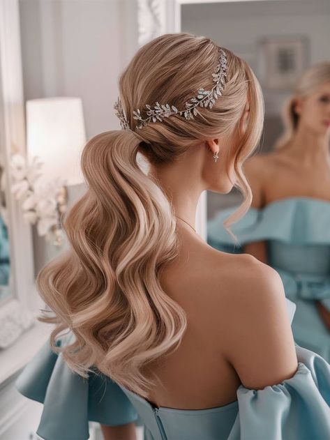 A soft, wavy ponytail styled elegantly for a bridal look. The hairstyle features a sparkling silver leaf hairpiece that enhances the sophisticated charm, perfect for weddings or formal occasions. Bridal Ponytail Hairstyles With Veil, Loose Ponytail Hairstyles Wedding, Bridal Hair Ponytail With Veil, Elegant Ponytail Hairstyles Wedding, Pony Tailed Hairstyle Wedding, Wavy Ponytail Hairstyles, Bridal Ponytail Hairstyles, Bride Ponytail, Bridal Pony