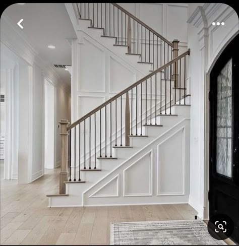 Transitional Banisters And Railings, Traditional Farmhouse Staircase, White Oak And Iron Stair Railing, Staircase Placement Ideas, Stairway With Window, Foyers With Staircases, Stairs With Landing In Middle, Transitional Staircase Railing, Feature Wall Stairs