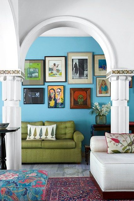 Discover the Delhi house owned and designed by the founder of Good Earth Anita Lal, who has filled it with bold patterns and bright colours on HOUSE - design, food and travel by House & Garden. Blue Paint Living Room, Delhi House, Blue Feature Wall, Blue Couch Living Room, Turquoise Living Room Decor, Painted Living Room Furniture, Picture Arrangements, Indian Living Room, Blue Lounge