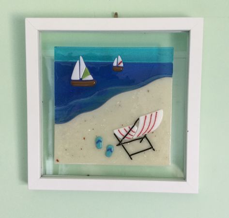 Fused glass beach scene. Framed fused glass art. Beach chair. 8x8 floating frame. Created by Patricia’s Pendants and Custom Fused Glass Diy Jars Ideas, Fused Glass Beach, Fused Glass Panel, Fused Glass Wall Art, Glass Art Pictures, Glass Fusion Ideas, Fused Glass Artwork, Painted Glass Art, Glass Fusing Projects