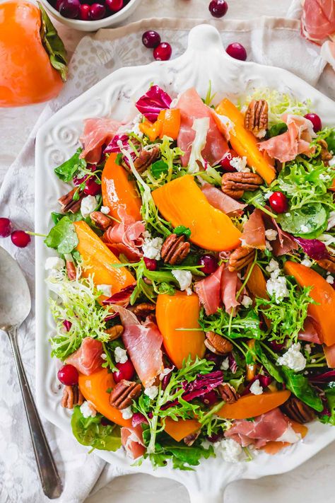 Sweet and juicy persimmons are the highlight of this wonderful winter salad with cranberries, prosciutto, goat cheese and toasted pecans. Persimmon Jam Recipe, Healthy Winter Recipes, Prosciutto Goat Cheese, Recipes Under 500 Calories, Persimmon Salad, Healthy Winter Meals, Leafy Green Salads, Holiday Eating, Winter Salad