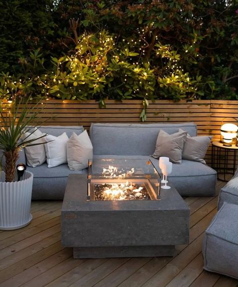 This one is the kind of deck patio with wood pallets on the floor and wall to make it feel warm and inviting. You should see the firepit in the center of the room to bring the warmth outside. The sofa looks cozy, the lighting is great, and the plants are adorable. Deck Patio from @stylebymll Courtyard Design, Light Wood Floors, Deck Patio, Backyard Garden Design, Outdoor Wicker, Outdoor Oasis, How To Decorate, Outdoor Lounge, Outdoor Sectional Sofa