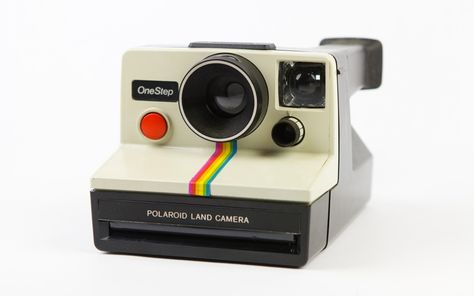 First founded in 1937, Polaroid owes much of its success to the instant camera. Long before digital cameras, the Polaroid instant camera allowed photographers to see their picture almost instantly - instead of waiting for it to be developed. Envisaged in 1943, it wasn't until the release of the SX 70 and the OneStep that they really took off - with the latter becoming the most sold camera in the US. Polaroid Camera Film, Polaroid Instant Camera, Vintage Polaroid Camera, Polaroid Snap, Polaroid One Step, Instant Print Camera, Instant Film Camera, Vintage Polaroid, Polaroid Camera