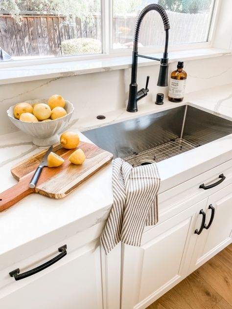 Bay Area design project. Vadara quartz counters, stainless steel sink, black industrial sink faucet, white kitchen cabinets Stainless Steel Sink White Countertops, Stainless Steel Undermount Sink Black Faucet, White Kitchen Cabinets Sink Ideas, Black Sink Stainless Appliances, Black Kitchen Faucet Stainless Sink, Black Sink With Stainless Faucet, Kitchen Sink With White Cabinets, White Cabinet Black Fixtures, Single Basin Sink Kitchen