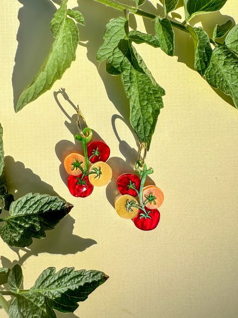 ! Clip-on and Hook are available. Please leave me a note at checkout!  The earring features a vibrant and detailed cherry tomato design that looks good enough to eat! Perfect for casual wear, garden parties, foodie events, and more. Add a playful touch to any outfit!  Length: ~2 inches (including hoop length) Each design of earrings is unique and cannot be exactly replicated. Extremely light and comfortable to wear. Slight variation may occur compared to the pictures as they are handmade items. Tomato Design, Weird Earrings, Acrylic Earring, Mini Earrings, Earrings Summer, Funky Earrings, Cherry Tomato, Summer Earrings, Unique Accessories