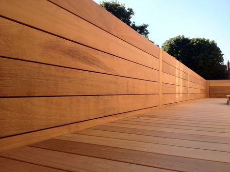 Iroko deck & wall cladding Balau Decking, Western Red Cedar Cladding, Deck Wall, Iroko Wood, Cedar Deck, Cedar Cladding, Hardwood Decking, Deck Installation, Cedar Fence