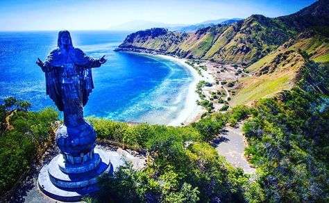 This is a picture of the famous Cristo Rei of Dili, located in the country of Timor Leste 🇹🇱⁣ ⁣ Cristo Rei of Dili (Christ the King of Dili) is a 27.0-metre-high (88.6 ft) statue of Jesus located atop a globe in Dili, East Timor. The statue was designed by Mochamad Syailillah, who is better known as Bolil. The statue was officially unveiled by Suharto in 1996 as gift from the Indonesian government to the people of East Timor, which was at the time still a province. ⛰⁣ ⁣ Fun Facts: East Timor w Sumber Daya Alam, Asia Map, East Timor, Timor Leste, Jaco, Southeast Asian, Tolu, South Pacific, Travel Goals