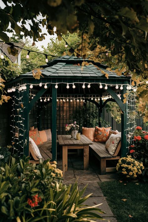 Cozy garden gazebo with string lights, outdoor seating, and colorful flowers. Closed Gazebo, Forest Gazebo, Garden With Gazebo, Backyard Gazebo Ideas, Gazebo Decorating Ideas, Gazebo Decor, Space Vibes, Creative Backyard, Gazebo Decorations