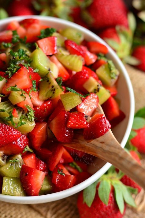 Strawberry Kiwi Fruit Salad. This simple fruit salad is made with fresh strawberries, kiwi, honey, and mint. It's a perfect fresh touch of sweetness to your summer table or a refreshing dessert with a scoop of vanilla ice cream. #fruitsalad #strawberrykiwi #summerdessert Tomatoes And Cucumber Salad, Kiwi Fruit Salad, Kiwi Desserts, Kiwi Fruit Recipes, Party Food Fruit, Kiwi Salad, Food For Runners, Salads With Fruit, Dessert Salad Recipes