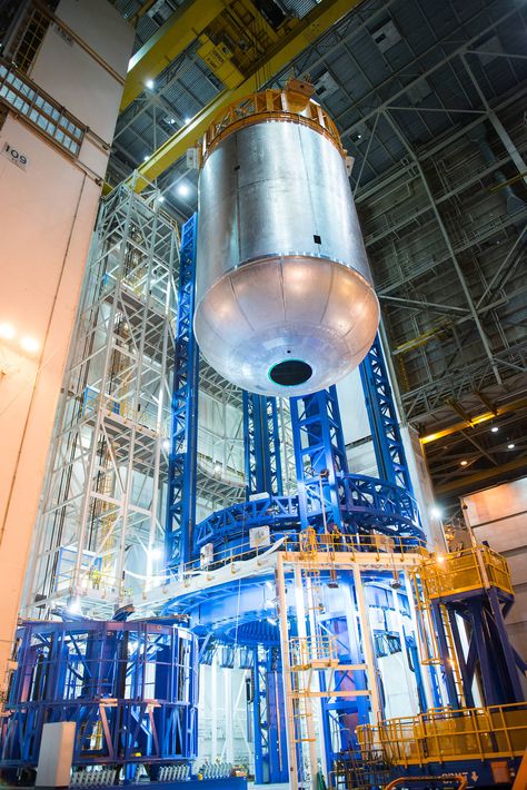 A liquid oxygen tank for NASA's new rocket, the Space Launch System, completes final welding on the Vertical Assembly Center at Michoud Assembly Facility in New Orleans. This is the first glimpse of what one of the two tanks will look like that make up the SLS core stage. Towering more than 200 feet tall with a diameter of 27.6 feet, the core stage will store cryogenic liquid hydrogen and liquid oxygen that will feed the vehicle’s RS-25 engines. Liquid Oxygen, Oxygen Tank, Space Launch System, Space Launch, Rocket, Nasa, Mars, Fuel