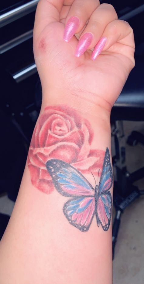 Colored rose and butterfly tattoo Rose With Butterfly Tattoo, Butterfly Tattoo For Women, Rose Wrist Tattoo, Butterfly Tattoo On Wrist, Rose With Butterfly, Pink Butterfly Tattoo, Rose And Butterfly Tattoo, Tattoo On Wrist, Butterfly Tattoos For Women