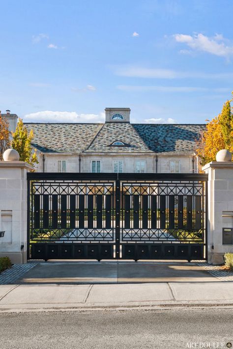 Located in one of the most prestigious neighbourhoods in downtown Toronto sits a palace gate exclusively crafted for this stunning estate. Featuring a bold and sophisticated design the sliding gates showcase meticulous details ranging from bronze metal accents, to beveled plates, and custom profiles. The stone work is precisely cut to allow the sliding gates to slide seamlessly within the stone columns. When closed the gate reveals its beautiful central astragal. Exterior Gate Design, Exterior Gate, Sliding Gates, Estate Gates, Home Gate Design, Entrance Gate, Window Grill, Boundary Walls, Stone Columns