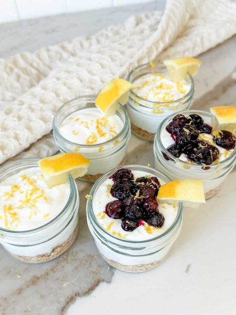 Lemon Cheesecake Jars are a delicious and healthy high protein snack or dessert. They are sweet and filled with bright lemon zest. Lovely Delites, Cheesecake Jars, High Protein Cheesecake, Healthy High Protein Snacks, Gluten Free Graham Crackers, Protein Cheesecake, Cheesecake In A Jar, Yogurt Bites, Single Serve Desserts