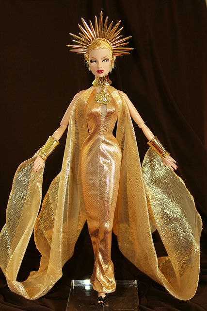 Morning  Sun  Princess  In  Full  Regalia  Eugenia  Perrin  Frost  is  wearing  a  fantasy gown  from  the  Morning  Sun  Princess  2000  barbie.  Its  part  of the  Celestial  Goddess  Collection  and  Mystical  Princess  of  the Sky. Sun Goddess Costume, Sun And Moon Costume, Sun Princess, Barbie Design, Moon Costume, Gold Costume, Goddess Costume, Golden Goddess, Fantasy Gowns