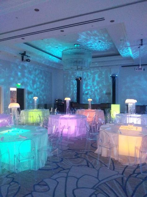 Venture under the sea with this unique glowing jellyfish display! Make your event unforgettable! 🐟️ Underwater Quinceanera, Mermaid Theme Quinceanera, Atlantis Prom Theme, Under The Sea Quinceanera Theme Dresses, Under The Sea Gala, Under The Sea Sweet 16, Under The Sea Quinceanera Theme, Grad Themes, Under The Sea Wedding