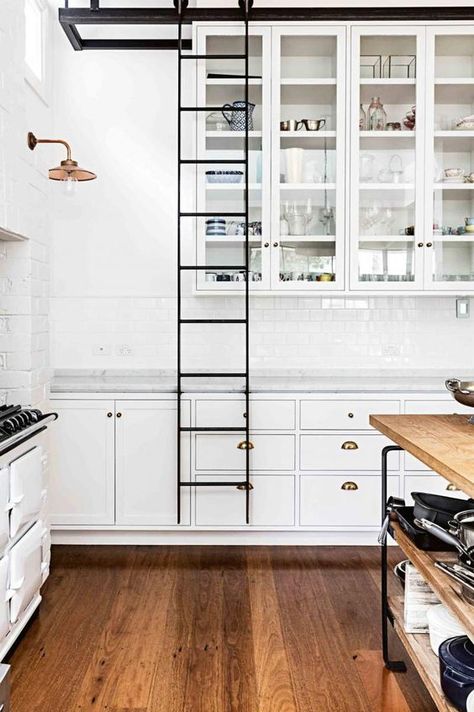 Rolling ladder--dream house storage set-up must. Kitchen Ladder, Modern Kitchen Apartment, Home Theaters, Casa Country, Edwardian House, Wooden Floors, Classic Kitchen, Kitchen Design Decor, Apartment Kitchen