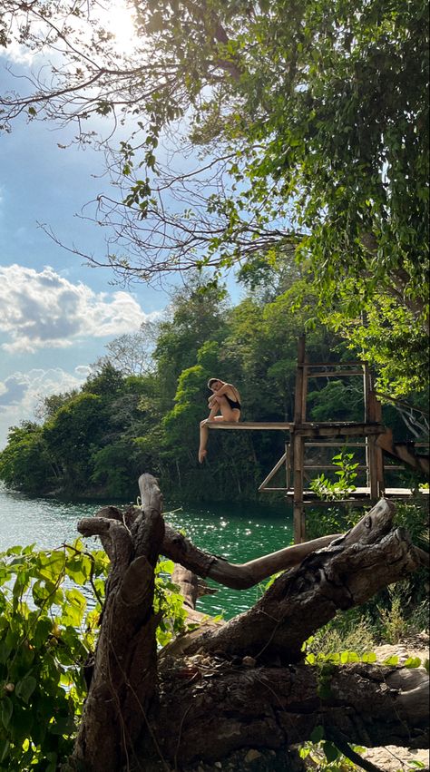 Girl sitting on springboard over Lake Péten, Guatemala. Lake Atitlan Guatemala Photography, Central America Aesthetic, Ideas Pictures Aesthetic, South America Aesthetic, Uruguay Aesthetic, Swimwear Outfit Ideas, Guatemala Aesthetic, Aesthetic Flores, Aesthetic Photoshoot Ideas