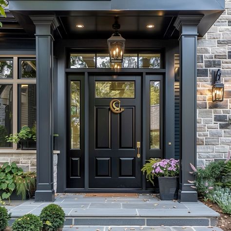 #exteriorcolors #housepainting #curbappeal #homeimprovement #colorinspiration #homedesign #outdoorliving #neighborhoodstyle #residentialarchitecture #exteriorrenovation Black Iron Front Door Entrance, Front Door With Top And Side Lights, Black Front Door On Brick House, Grey House Black Door, Black Front Door Hardware, Black Front Door Decor, Farmhouse Front Door Ideas, House Exterior Black, Black Trim Exterior House