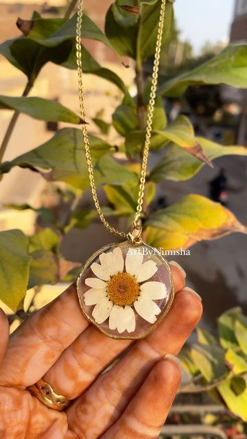 Macrame • Resin • Flower preservation • Gifts on Instagram: "Perfect for all your outfits 🤍 Daisy necklace 🤍 Dm for details ✨ . . . . . . . . . . . . . . . resin pendant resin necklace pendants resin art pendant resin pendant india Resin pendants and jewellery flowerpendants lil resin pendants #resinbracelet #resinjewellery #resinaccessory #resinaccessories #accessories #jewelry #jewellery #resinnecklace #resinpendant #resinearrings #resinart #resinpour #resindiy #smallbusiness #smallbusinessowner #giftforher #gift #smallbusinessindia #artist #resinartwork #resinart" Resin Art Pendant, Resin Flower Preservation, Resin Pendants, Flower Preservation, Resin Bracelet, Daisy Necklace, Resin Artwork, Necklace Pendants, Art Pendant