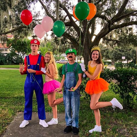 Princess Daisy And Princess Peach Costumes, Mario Crew Costumes, Mario Luigi Princess Peach Costume Trio, Super Mario And Princess Peach Costumes, Mario And Daisy Costume, Daisy Mario Kart Costume Diy, Super Mario Daisy Costume, Diy Mario And Peach Costumes, Luigi And Daisy Halloween Costume