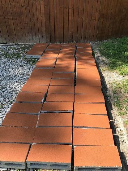 My daughter gave me her used privacy fence and I had asked here on HomeTalk in early May for some suggestions to cover the gaps that wouldn't break the bank. After some pricing of regular landscape stones - I decided on using the 4 inch cider blocks which are half the width of a regular cider block (with two holes on top instead of 4) These are 16 in long and only $1.08 at Home Depot. I painted them to match the fence - Home Depot does a great job matching your paint to your project… Porch Privacy Screen, Landscape Stones, Painted Shower Tile, Porch Privacy, Pottery Barn Lamps, Stepping Stone Walkways, Wood Privacy Fence, Patio Privacy Screen, Painting Shower