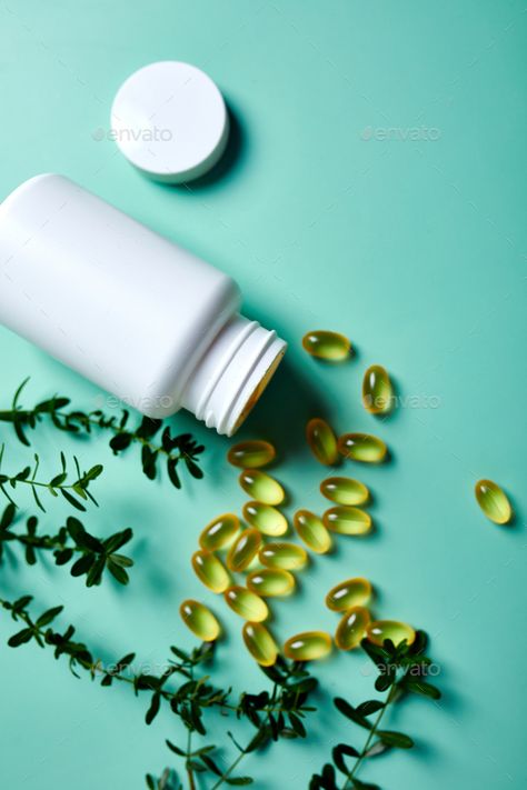 Capsules with fish oil and green leaves on green background by bondarillia. Capsules with fish oil and green leaves on green background, Healthcare concept, healthy food, Top view, copy space. #Sponsored #leaves, #background, #bondarillia, #green Supplements Aesthetic Photography, Food Supplement Photography, Vitamins Photography Ideas, Capsule Medicine Photography, Green Supplements, Food Top View, Fish Oil Benefits, Fish Oil Capsules, Scene Pictures