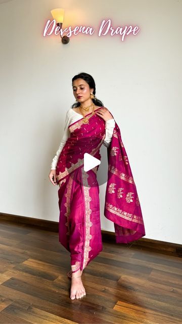 𝐀𝐫𝐜𝐡𝐞𝐞 | Saree Drapes on Instagram: "Devsena Saree Look from Bahubali | Save and send this easy saree tutorial to a saree lover 🌸

Pure silk saree of the day- is a katan banarasi in dual tone of plum and pink. I believe it is the saree that actually enhanced the look of the drape.

How to wear saree in Devsena Style-
🌸 Choose weightless and easy drape pure silk saree fabrics like katan silk, mulberry silk, mysore silk.
🌸 Pick Kanjivaram, Kanchipuram, satin silk and tussar silk if they’re longer than 5.5m.
🌸 Pick a contrasting blouse design so your saree highlights well. Refer to pinterest for blouse design ideas.
🌸 Follow the above tutorial, keep pinning every time you pleat the saree to easily undo it whenever required.
🌸 Accessories with temple jewellery, go for chain jhumki, Devsena Saree Draping Tutorial, Styling Banarasi Saree, Satin Silk Saree Blouse Designs, Devsena Saree Draping, Pink Silk Saree Look, Pink Dress Jewelry Ideas, Tussar Silk Saree Blouses, Devsena Look, Banarasi Saree Draping Styles