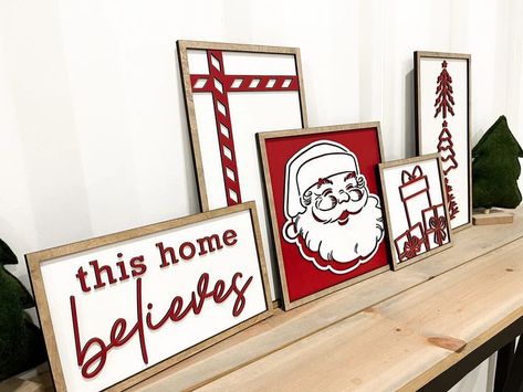 Brighten up your mantle with cute Christmas signs, framed art sets, and candy cane stripes. Discover delightful decorations that bring joy to your home during this magical time of year! Cute Christmas Signs, Santa Mantle, Wood Laser Ideas, Laser Cut Decor, Christmas Wooden Signs, Laser Cut Wood Crafts, Christmas Mantle, Candy Cane Stripes, Christmas Svg Files