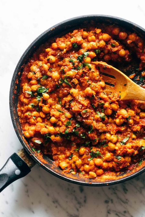 Harissa Chickpeas with Whipped Feta! Perfectly spicy/saucy/tomato-y chickpeas smothered in creamy, garlicky whipped feta and served with naan, lemons, and cucumbers. Your next weeknight wonder! #harissa #chickpeas #easydinner Feta Dinner, Harissa Chickpeas, Harissa Recipes, Chili Garlic Paste, Moroccan Recipes, Pinch Of Yum, Vegetarian Main Dishes, Whipped Feta, Chickpea Recipes