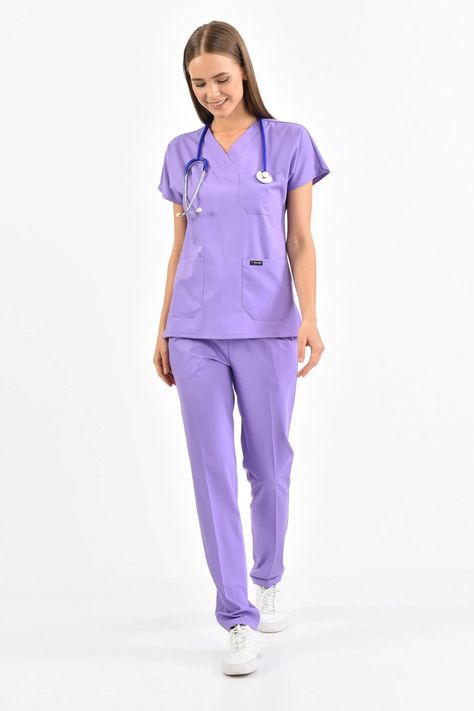 Specially produced for healthcare professionals and spa workers. It is a flexible, breathable fabric and wear resistant. It is made of quality fabric and provides a comfortable use. The Medical Lycra Model is a Set Consisting of 2 Parts, Upper and Lower. - Upper and lower parts are produced from the same color fabric and they never separate colors as a set. - There are 3 pockets in total, 2 in the skirt section and 1 in the chest section. - The Bottom Part Has 3 Pockets, 2 of which are Large in Lilac Scrubs, Scrubs Uniform Cute Medical, Scrubs Fashion, Doctor Uniform, Laces Fabric, Hospital Uniform, Medical Scrubs Fashion, Spa Uniform, Medical Scrubs Outfit