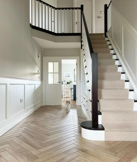 Large spacious hallway with white panelling and Cornforth White walls. Black And White Hallway, Amanda Allen, Modern Hallway Design, Stairs And Hallway Ideas, Stair Paneling, White Hallway, Cornforth White, Hallway Colours, Large Hallway