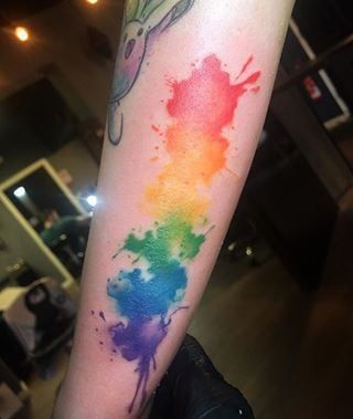 Rainbow Watercolors Rainbow Watercolor Tattoo Backgrounds, Splatter Tattoo, Wolf Tattoo Forearm, Lgbt Tattoo, Inspiring Tattoos, Pride Tattoo, Simple Tattoos For Guys, Rainbow Tattoos, Girl Back Tattoos