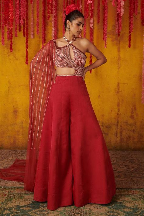 Buy #ruby #red embroidered #jumpsuit in #sequins and cutdana work with flared pant and attached drape by #PinkPeacockCouture at #AzaFashions Shop online now at #Azafashions.com Call +12132135273 or email contactus@azafashions.com for enquiries. #wedding #festive #ethnic #tradional #shopping #shoponline #party #reception #bride Peacock Couture, Embellished Jumpsuit, Embroidered Jumpsuit, Elevated Casual, Pink Peacock, Chic Tops, Wedding Dresses For Girls, Party Wear Indian Dresses, Dress Indian Style