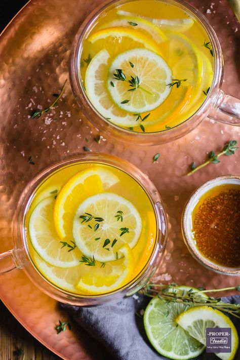 Steamy and hot honey and lemon tea with sliced lemon and fresh thyme Water With Lime, Lamb Pie, Honey Lemon Tea, Honey And Warm Water, Lemon Water Health Benefits, Boil Lemons, Lemon Water Before Bed, Sliced Lemon, Lemon Juice Benefits