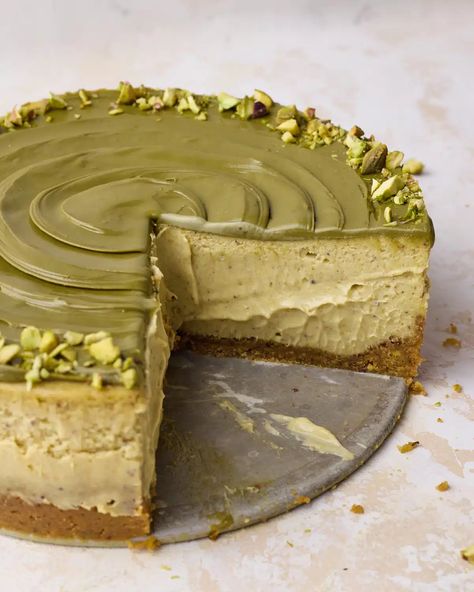 This easy pistachio cheesecake is a baked cheesecake with pistachio graham cracker crust, pistachio cheesecake filling and topped with pistachio cream and chopped pistachios. With pistachio paste in the cheesecake batter and pistachio cream on top, this delicious dessert is packed with pistachio flavor. Delicious dessert for dinner parties or holidays. Easy Pistachio Cheesecake Recipe, Honey Pistachio Cheesecake, Pistachio Gift Ideas, Cheesecake Recipes Pistachio, Best Pistachio Dessert, Pistachio Cream Cheesecake, Pistachio Ricotta Cheesecake, Pistachio Basque Cheesecake, Pistachio Spread Uses