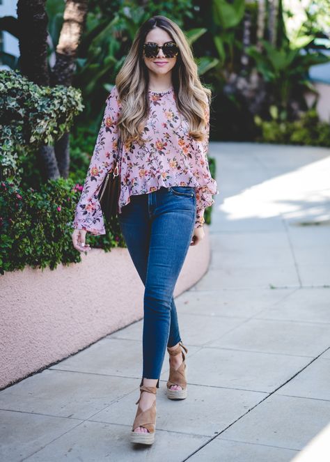 Here are a few snapshots of a look I wore over the weekend during our trip to Los Angeles. Thankfully, we lucked out with some beautiful weather and 70° temperatures. It was a nice break from the rain back in Dallas! This floral ruffled top was the perfect blouse to wear as we explored the city. It’s light and … Floral Top With Jeans, Floral Tops Outfit, Beautiful Tops With Jeans, Jeans And Blouse Outfit, Zimmerman Top, Floral Blouse Outfit, Floral Top Outfit, Blouse With Ruffles, Western Wear Outfits