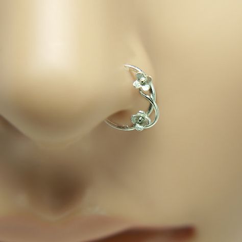 Pico Loves your Nose!!! Unique, perfectly fit, especially for you, Sterling silver Tiny flower motif nose ring! Organic look! handmade of Sterling Silver. ****MATERIALS Nose ring made of 100% Sterling Silver. Nose ring is shiny polished (by hand) finish. Smooth to the touch. ****SIZE inner diameter: To choose when buying this nose ring. *****AVAILABLE AS OPTION Left or right nostril, inner diameter nose ring 7mm, 8mm, 9mm, 10mm 11mm. ****GAUGE Gauge: The thickness of the wire (nose stud sha... Cute Nose Rings, Nose Piercing Ring, Cute Nose Piercings, Nose Ring Jewelry, Nose Piercing Hoop, Tragus Earring, Helix Earring, Cool Piercings, Nose Piercing Jewelry