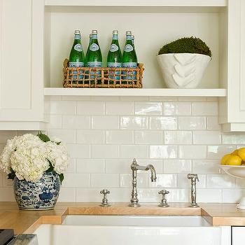 Cottage White Kitchen, Sarah Bartholomew, Nantucket Cottage, Small Cottage Kitchen, White Shaker Cabinets, Cottage Kitchens, Farm Sink, Row House, Wood Countertops