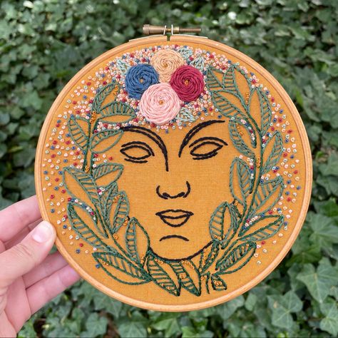 Hand-embroidered using #stemstitch and #frenchknots, cotton thread with metallic gold thread details. #handembroidery #embroiderydesign #greekmythology #goddess #mythology #floralembroidery #springtime #embroideryhoop #hoopart #wallhanging #handmade #EugeneOregon Persephone Embroidery, Virgo Embroidery, Aphrodite Embroidery, Goddess Embroidery, Statue Embroidery, Eugene Oregon, French Knots, Gold Threads, Cotton Thread