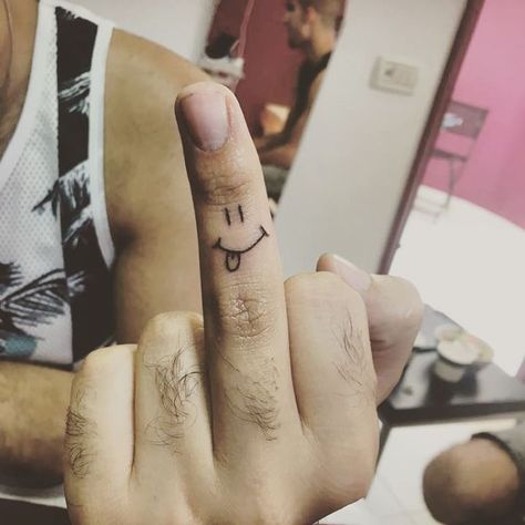 Smiley finger tattoo Finger Image, Finger Meaning, Unique Tattoos Black Women, Smiley Face Tattoo, Middle Finger Tattoos, Smile Tattoo, Skeleton Hand Tattoo, Hand Poked Tattoo, Finger Tattoo