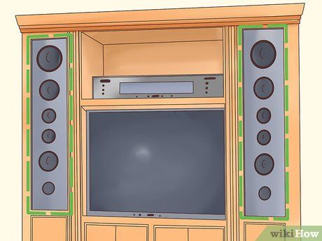 Tv Wall With Built In Speakers, Hidden Speakers Living Room, Hiding Speakers In Living Room, How To Hide Speakers Living Rooms, Hide Speakers In Living Room, Surround Sound Speakers Hide, Diy Wall Unit, Basement Entertainment Center, Living Room Speakers