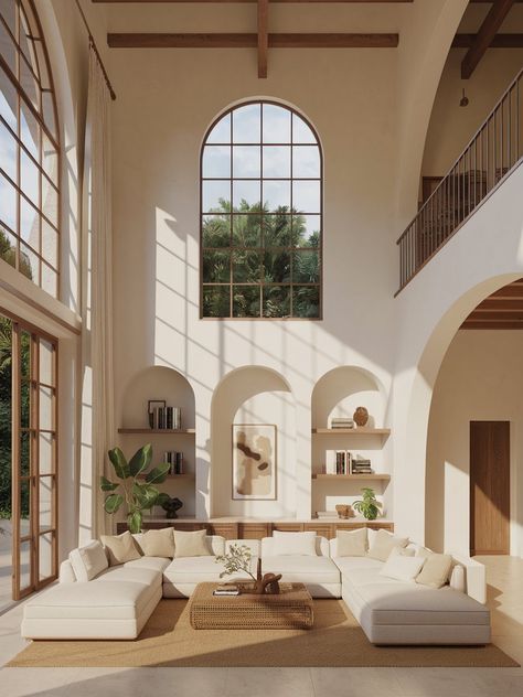 Step into this breathtaking Mediterranean-style living room, where organic curves, arched openings, and warm textures create a serene escape! 🏡✨ A double-height space with a mezzanine, a plush white sectional, and woven rattan accents bring effortless charm. 🌿☀️ Natural light pours through grand arched windows, highlighting built-in shelving filled with books, ceramics, and lush greenery. Would you love to relax here? 💛 
#MediterraneanStyle #ArchedInteriors #BohoChic #OrganicModern #WhiteAesthetic #RusticCharm #HomeDecorLover #MinimalistLuxury #AirySpaces #DreamyInteriors Mediterranean Style Living Room, Rattan Accents, White Sectional, Mediterranean Living, Double Height, Mediterranean Home, Arched Windows, Woven Rattan, Contemporary Living Room