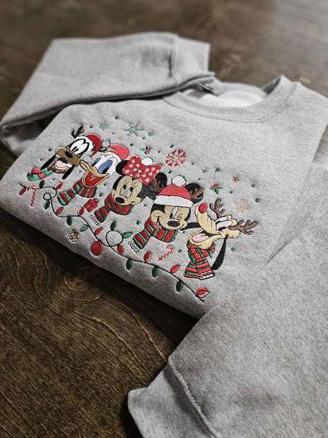 This ADORABLE crewneck sweatshirt is the perfect apparel for the Christmas season! It is super soft and fleece lined. You also get the option to choose 1 of many designs to go on the right sleeve for $5 additional! Don't see a color sweatshirt you like? Easy! Just message me with a color you had in mind, and I will see if I can get it for you! **please note: Due to the big variety of color options, I order the sweatshirts after you have purchased- so the vendor I use sometimes runs out of specif Gingerbread Santa, Gingerbread Bakery, Christmas Mickey, Mouse Christmas, Sweater Christmas, Pull Sweat, Embroidered Sweatshirt, Mens Long Sleeve Tee, Holiday Sweater