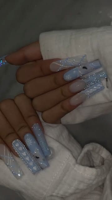 Riya Thai on Instagram: "Baby Blue Christmas ❄️ 𝐏𝐫𝐨𝐝𝐮𝐜𝐭𝐬 𝐲𝐨𝐮'𝐥𝐥 𝐧𝐞𝐞𝐝: #116#079  - No wipe matte top coat  - Reflective glitter (rainbow dream) - 𝐒𝐨𝐟𝐭 𝐠𝐞𝐥 𝐭𝐢𝐩  𝐗𝐋 𝐒𝐪𝐮𝐚𝐫𝐞 ✨ 𝐄𝐱𝐭𝐞𝐧𝐝 𝐠𝐞𝐥 🛍️𝐒𝐡𝐨𝐩 𝐑𝐢𝐲𝐚𝐬𝐍𝐚𝐢𝐥𝐬.𝐜𝐨𝐦" Blue Glitter Tip Nails, Icy Nails Acrylic, Light Blue Birthday Nails, Stiletto Blue Nails, Light Blue Nails Winter, Blue Snow Nails, Light Blue Prom Nails, Baby Blue Christmas Nails, Baby Blue Winter Nails