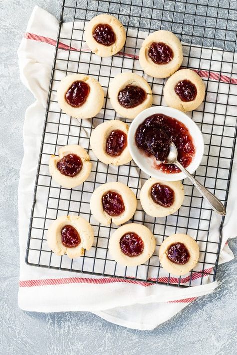 Tender-crisp and buttery, these Thumbprint Cookies can be filled with any jam you love. A class at Christmas, they shine like gems on your cookie plate! Thumbprint Jam Cookies, Cookie Plate, Church Gifts, Jam Cookies, Cooling Racks, Thumbprint Cookies, Baking Sheets, Dessert Ideas, A Class