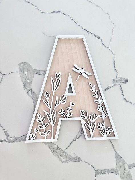 Transform your space with charming wildflower room decor. Explore letter painting ideas and boho name signs that bring a touch of nature into your home! Letter Decoration Ideas, Boho Name Sign, Wooden House Decoration, Girls Room Sign, Painted Wood Letters, Wildflower Wall, Mounting Putty, Alphabet Lettering, Wooden Alphabet Letters