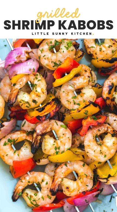 Grilled Shrimp Kabobs are the summer dinner that’s ready in minutes! Marinate the shrimp in lemon, garlic, and herbs with bell peppers and onions. Grilled Shrimp Kabobs, Shrimp Kabob Recipes, Little Sunny Kitchen, Shrimp Kabobs, Vegetable Kabobs, Grilling Kabobs, Vegetable Skewers, Sunny Kitchen, Shish Kabobs