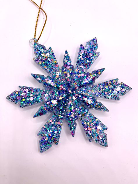 Add some extra sparkle to your Holiday tree with a handmade 4 inch resin snowflake ornament.  Each snowflake is handcrafted  giving each snowflake it's own unique beauty. They are all made of high-transparency epoxy resin to ensure that the inclusions better show the sparkling effect. Because of the handmade nature of our snowflakes, each set will vary slightly in color proportions and sparkle placement. Resin Snowflakes, Christmas Resin, Resin Ornaments, Snowflake Christmas, Pink Sparkle, Snowflake Ornaments, Unique Beauty, Gold Flakes, Clear Resin