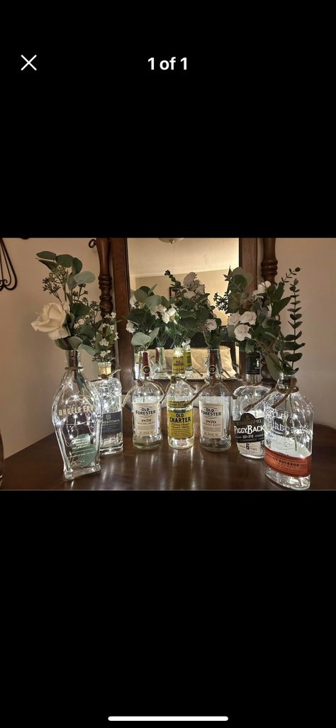 Centerpieces With Liquor Bottles, Alcohol Centerpieces Parties, Alcohol Bottle Centerpieces Wedding, Alcohol Bottle Centerpieces, Whiskey Bottle Centerpiece, Bottle Centerpieces, Wedding Apparel, Alcohol Bottles, Liquor Bottles