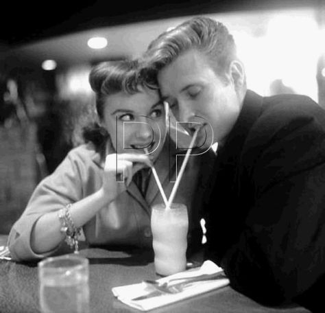 1950's Sharing a Milkshake Couple Milkshake, 1950s Milkshake, Grease Diner, 1950 Couple, Sharing A Milkshake, 50s Couple, Retro Engagement Photos, Couple Stock Photo, Themed Engagement Photos